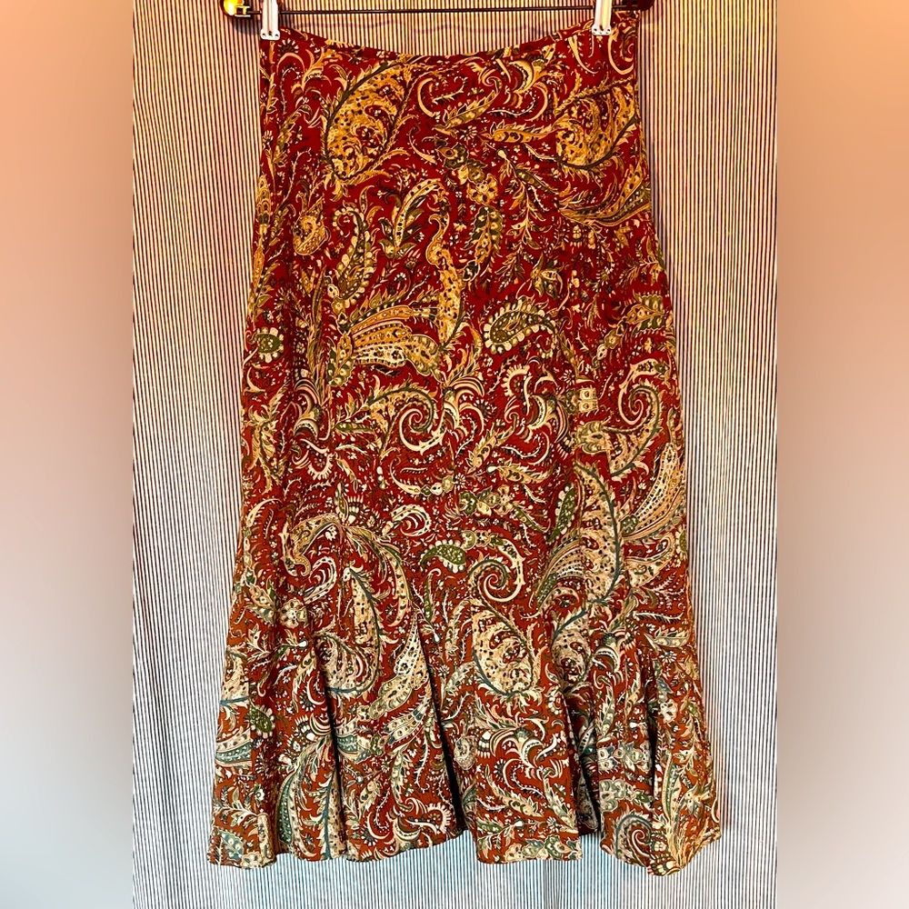 Below knee length skirt, hiapacious and flattering.